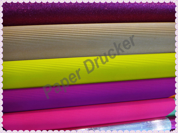 Fluorescent corrugated paper